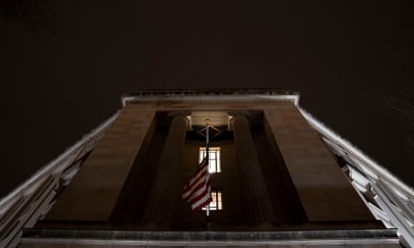 outside of a building with an American flag hanging